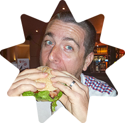 Stuart eating a burger