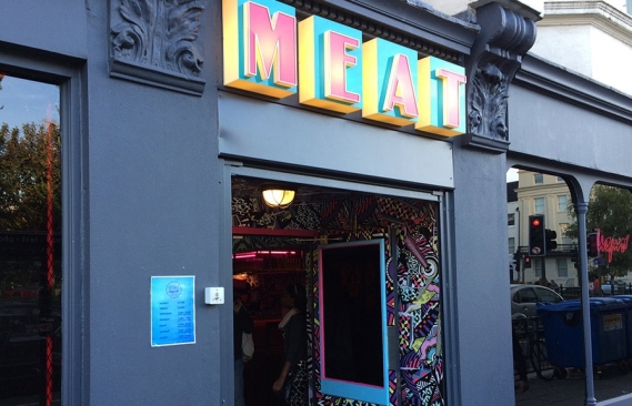 The front of Mearliquor in Brighton with the big sign and the brightly coloured décor.