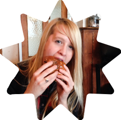 Abby stuffing her face with a tasty, delicious burger