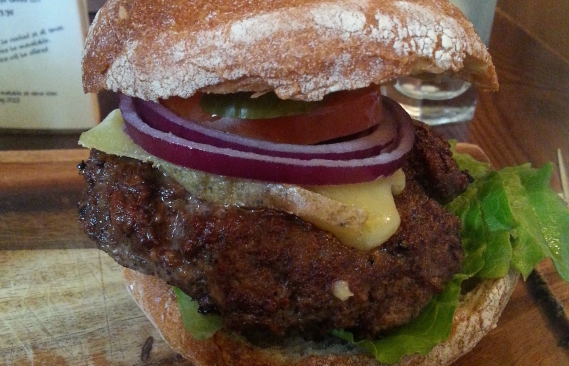 A close up of the burger badly photoshopped to fit this image aspect ratio