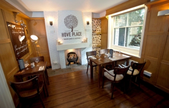 Where we sat by the fireplace and window in the pub