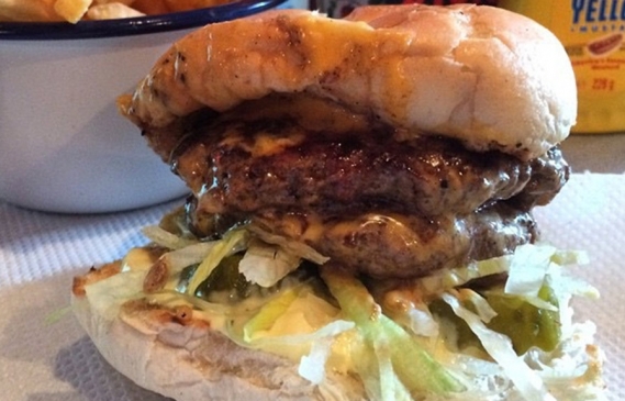 A delicious dead hippie burger, oozing with cheese, dead hippy sauce, onions and lettuce.