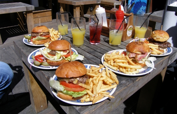 An image of the table of burgers from the BBQ Shack at the World's End pub.