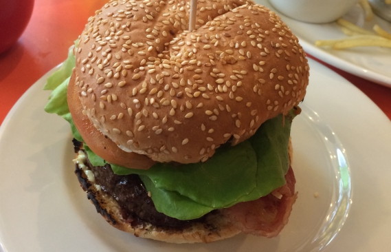 A close up of the burger which has unfortunately been speared