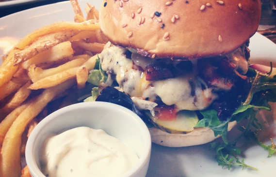 A close up of Greg's burger which is full of... everything